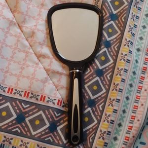 Small handheld mirror